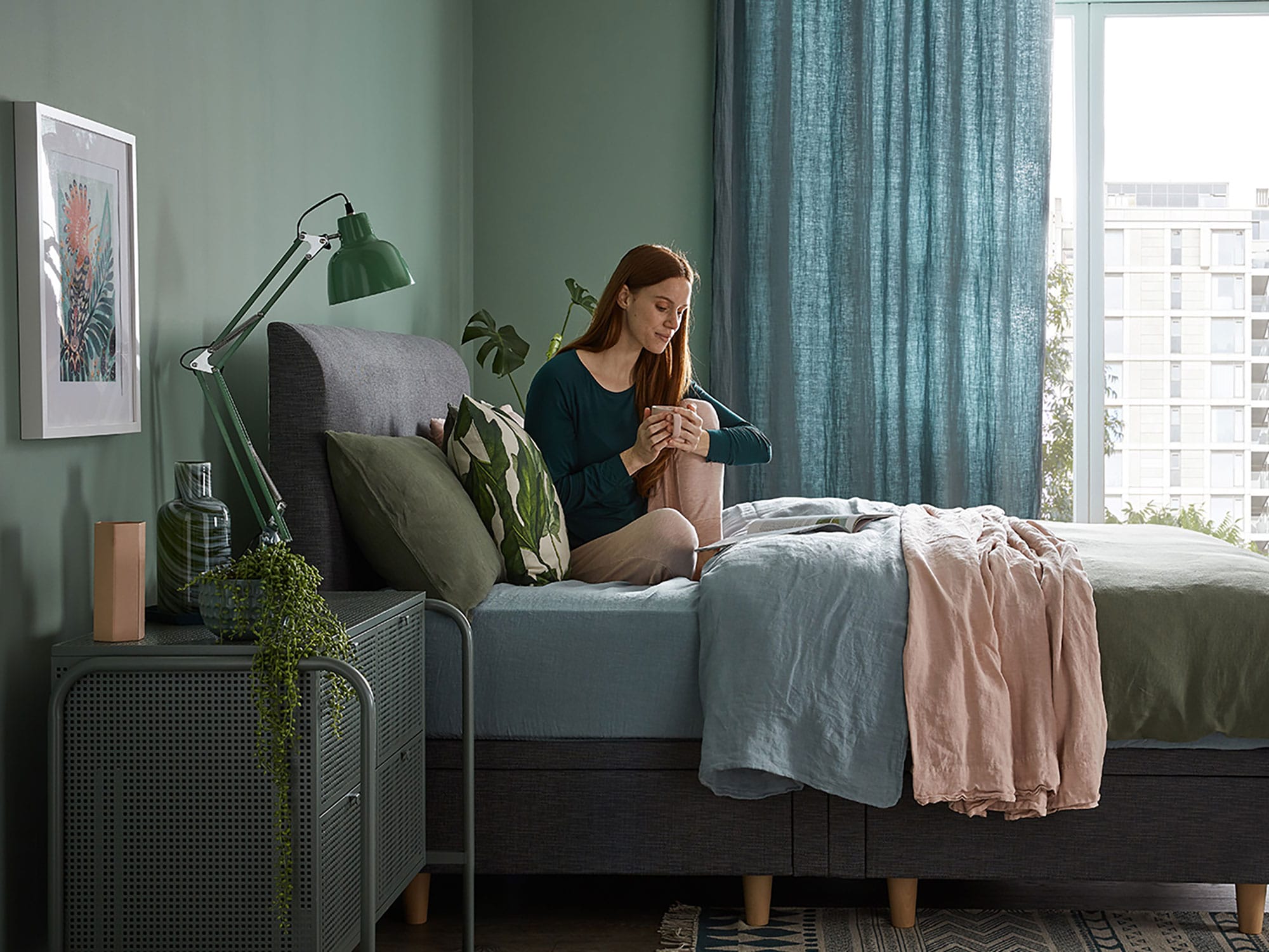 A woman sitting on a Silentnight Divan.